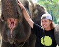 Beautiful unique elephant with man tourist at an elephants conservation reservation in Bali Indonesia