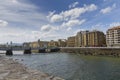 Beautiful and unique La Zurriola Bridge under the blue sky on the Urumea river in Spain Royalty Free Stock Photo