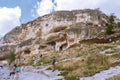 Mountain with natural and man-made caves, a place of active visit by tourists and travelers