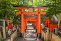 Beautiful unique red wooden gates in a garden Fushimi inari shrine in Kyoto Japan Royalty Free Stock Photo