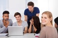 Beautiful University Student Sitting With Classmates Using Laptop Royalty Free Stock Photo