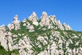 Beautiful unusual shaped mountain rock formations of Montserrat and blue sky Royalty Free Stock Photo