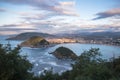 Beautiful upper aerial view on san sebastian coastline from mountain monte igueldo in colourful sunset sky