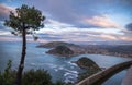 Beautiful upper aerial view on san sebastian coastline from mountain monte igueldo in colourful sunset sky