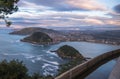 Beautiful upper aerial view on san sebastian coastline from mountain monte igueldo in colourful sunset sky