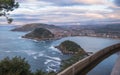 Beautiful upper aerial view on san sebastian coastline from mountain monte igueldo in colourful sunset sky