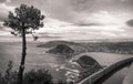 Beautiful upper aerial view on san sebastian coastline from mountain monte igueldo in sunset sky in black and white sepia