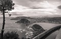 Beautiful upper aerial view on san sebastian coastline from mountain monte igueldo in sunset sky in black and white sepia