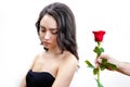 Beautiful upset girl receives one red rose. Royalty Free Stock Photo