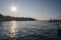 Beautiful urban landscape in Chania old harbour with sun flare shining