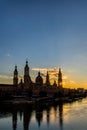 Urban sunset over the Pilar cathedral in Zaragoza, spain and the Ebro river Royalty Free Stock Photo