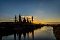 Urban sunset over the Pilar cathedral in Zaragoza, spain and the Ebro river Royalty Free Stock Photo