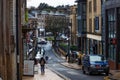 Beautiful urban view of parked cars and traditional buildings in Harrogate on a rainy day