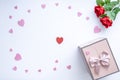 Beautiful Valentine`s Day background with red hearts, red roses and gift box on white banner background.