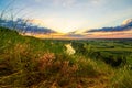 A beautiful valley with a river, blue sky with large clouds and bright sun. Aerial Royalty Free Stock Photo