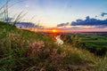 A beautiful valley with a river, blue sky with large clouds and bright sun. Aerial Royalty Free Stock Photo