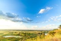 A beautiful valley with a river, blue sky with large clouds and bright sun. Aerial 4K UHD Royalty Free Stock Photo