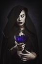 Beautiful vampire with a ritual cup Royalty Free Stock Photo