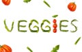 Beautiful variety of vegetables arrange into a word "veggies". Background, top view, diet, concept