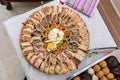 Various delicious canapÃ©s served in a plate on the table