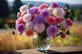 Beautiful vase with asters on the table on a beautiful nature background