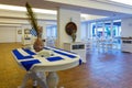 Beautiful vase with the flag of Greece on a white table covered with a tablecloth in form of the flag of Greece, the interior of a Royalty Free Stock Photo