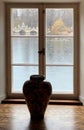 Vase overlooking a window Royalty Free Stock Photo