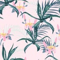 Beautiful vector floral seamless pattern background with agave, palm leaves and exotic flowers. Royalty Free Stock Photo