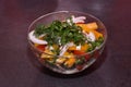 Beautiful vegetable salad in a transparent plate
