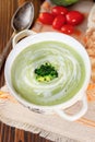 Beautiful vegetarian brocoli soup in a white bowl.