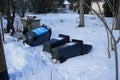 Garbage bins falling on the snow. Berlin, Germany