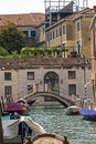 beautiful Venetian canal in Venice with gondolas and other public water transport Royalty Free Stock Photo