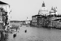 Beautiful Venetian view with Grand Canal, Basilica Santa Maria della Salute and traditional gondolas, in Venice, Italy black and Royalty Free Stock Photo