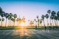 Venice beach Sunset in Los Angeles with a pedestrian walk during orange sunset. Empty beach Royalty Free Stock Photo