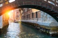 Beautiful Venice canal in early morning light. Old narrow canal with one parked boats, Venice, Italy. Picturesque cityscape of