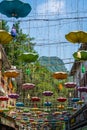 Beautiful vertical picture of Chinese lights and decoration against foliage mountains