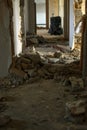 Beautiful vertical shot of an abandoned corridor with ruined walls