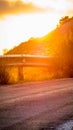 Beautiful vertical shot of a blinding bright sunset sky from a road Royalty Free Stock Photo