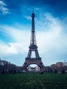 Beautiful vertical shot of the Eiffel Tower on a bright blue sky background