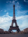 Beautiful vertical shot of the Eiffel Tower on a bright blue sky background