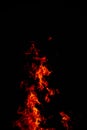 Beautiful vertical shot of a large burning fire at night Royalty Free Stock Photo