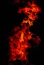 Beautiful vertical shot of a large burning fire at night Royalty Free Stock Photo