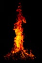 Beautiful vertical shot of a large burning fire at night Royalty Free Stock Photo