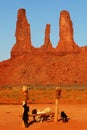 Beautiful vertical shot of sheep in front of orange rock formations at Oljato-Monument Valley,  USA Royalty Free Stock Photo
