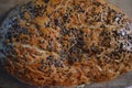 Beautiful very hearty bread homemade recipe. Brown bread with crispy crust, black caraway seeds and brown flax kernels. Royalty Free Stock Photo