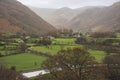 Beautiful vibrant Autumn landscape image towards Borrowdale Valley from Castle Crag in Lake Disrtrict