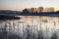 Beautiful vibrant English countryside lake image with frost and Royalty Free Stock Photo