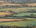 Beautiful vibrant late Summer sunrise on South Downs National Park in English countryisde with sunlight on hills