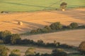 Beautiful vibrant late Summer sunrise on South Downs National Park in English countryisde with sunlight on hills