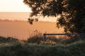 Beautiful vibrant late Summer sunrise on South Downs National Park in English countryisde with sunlight on hills